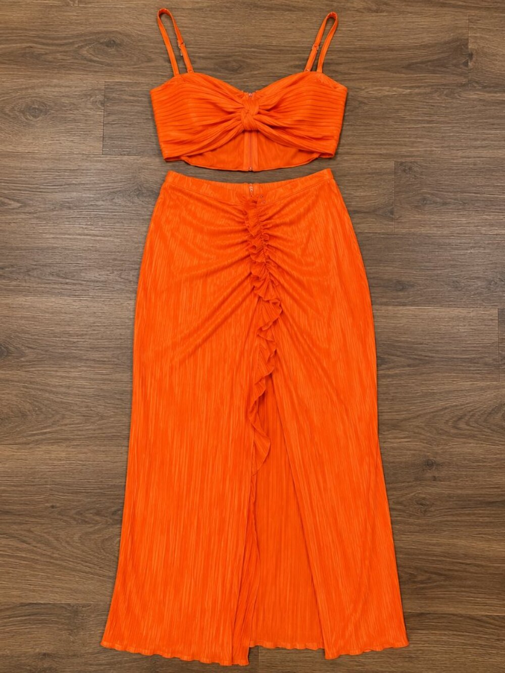 Serving bold baddie energy in this 🔥 vibrant orange two-piece set!